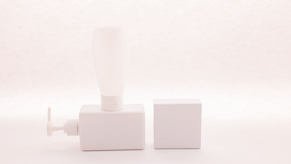 A white pump bottle on a bright, clean background